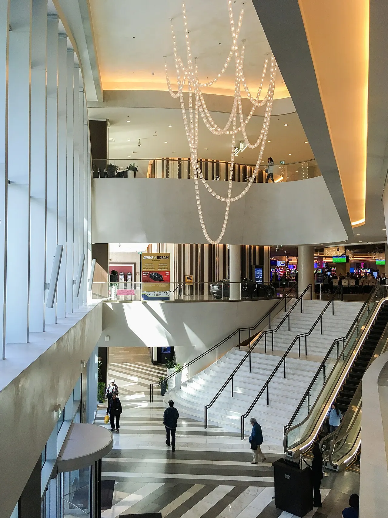 Inside Parq Vancouver: the tall lobby atrium with escalators